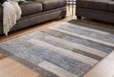 Warmstead Furniture - Ashley Furniture - Sethburn Rug - 5' x 7' Rug / Cream/Brown/Gray - R406592